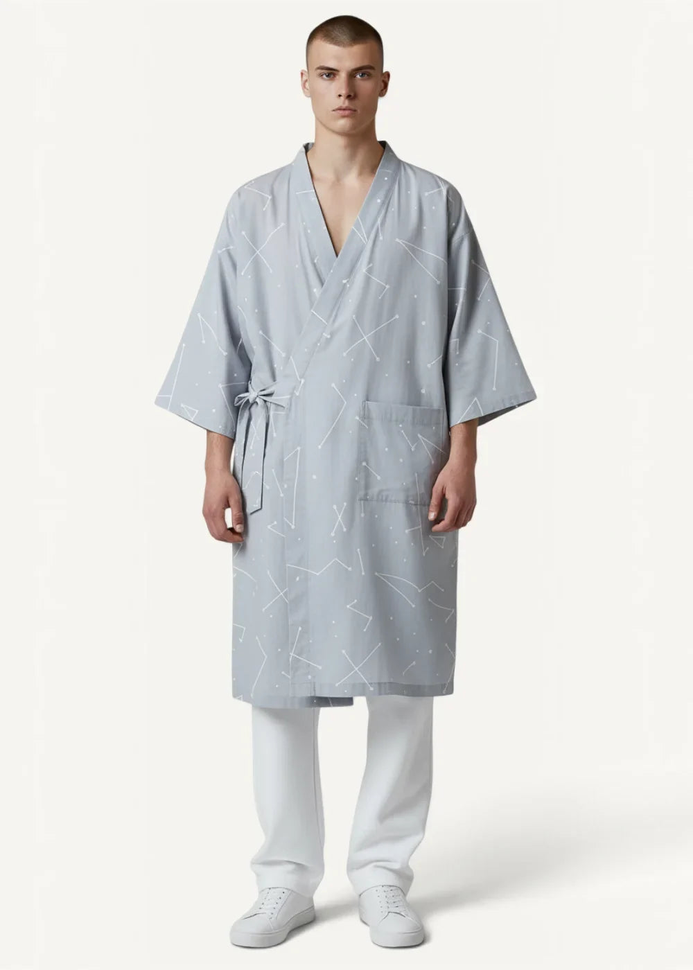 Light blue cotton kimono dressing gown with subtle constellation pattern v-neckline and tied waist front view