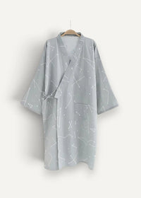 A light gray cotton kimono dressing gown with a white constellation pattern v-neckline and tied waist