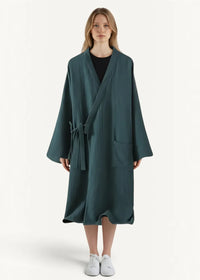 A dark teal kimono dressing robe with long sleeves textured fabric and matching tie belt