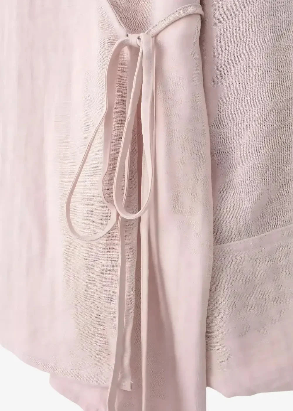 A soft blush pink linen kimono top with a delicate self-tie belt at the neckline for a stylish set