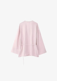 Soft pink kimono linen set blouse with wide sleeves and drawstring waist made of breathable fabric