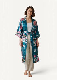 Kimono long satin robe in teal with pink and white floral pattern belted at the waist