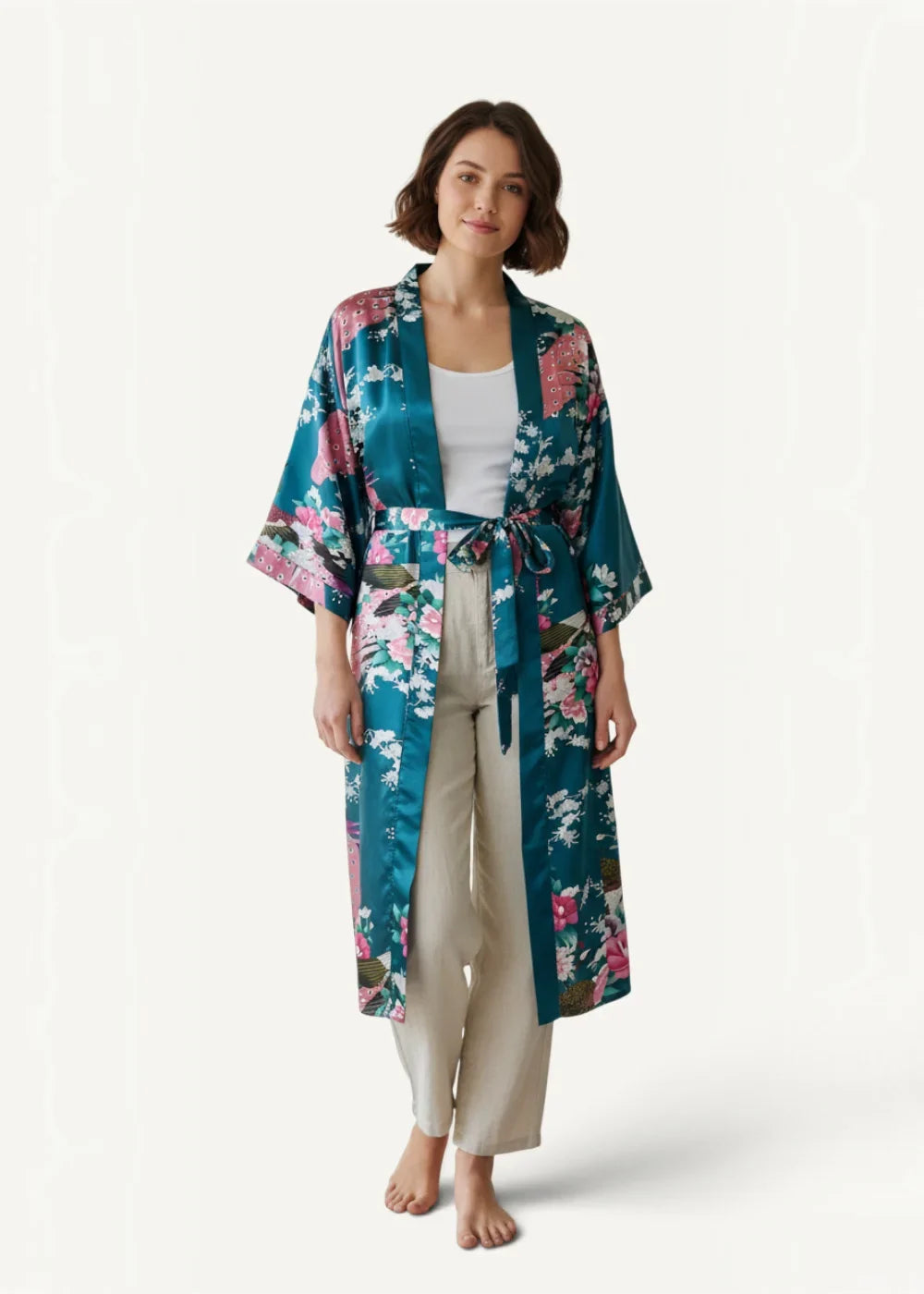 Kimono long satin robe in teal with pink and white floral pattern belted at the waist