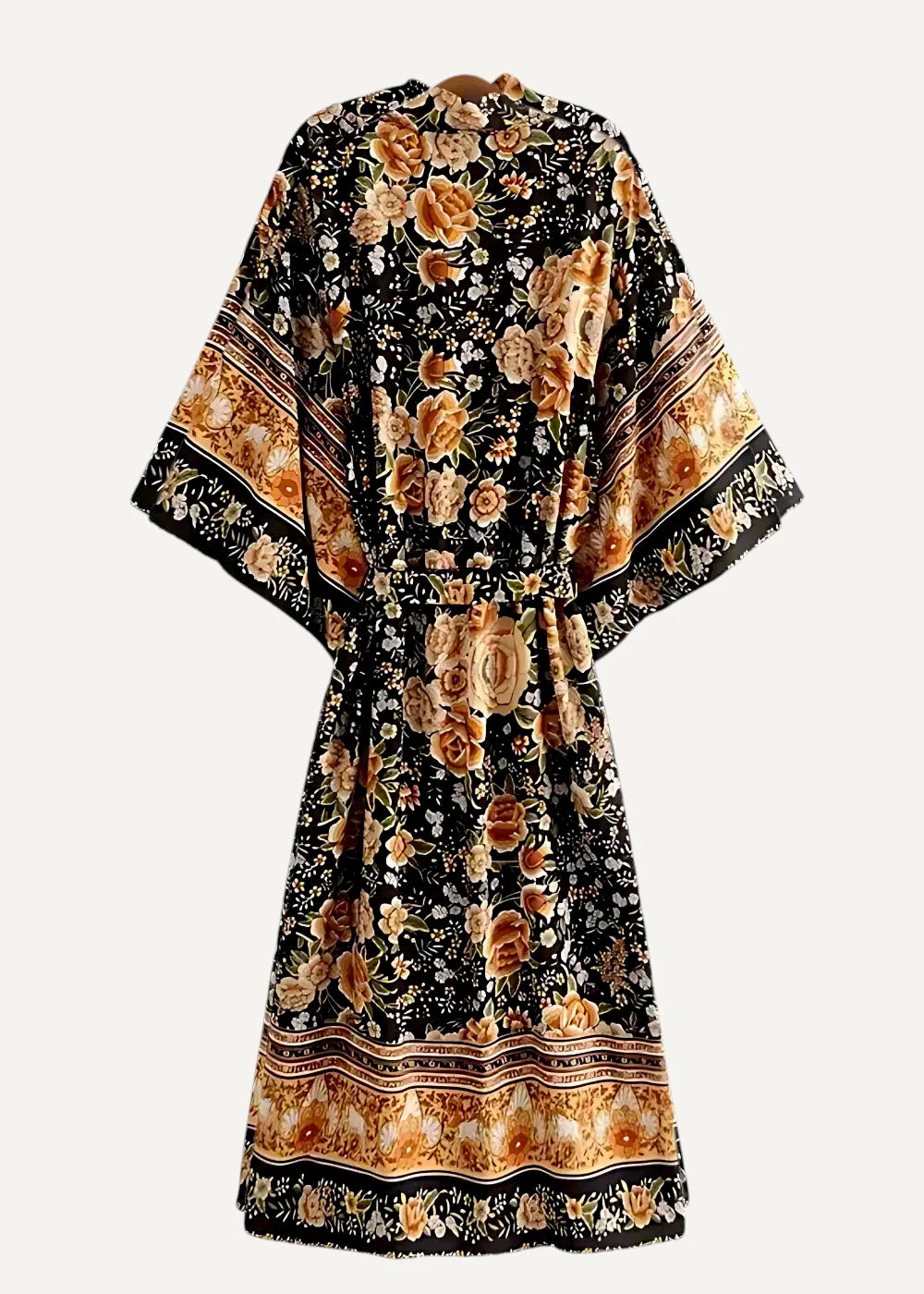 Black kimono midi dress with wide sleeves cinched waist and orange gold rose patterns on hemline and cuffs