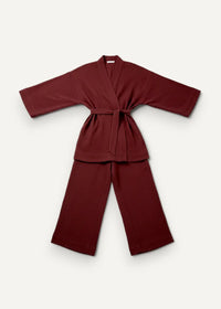 Maroon kimono pajama set with soft texture featuring a tied belt and matching wide-leg pants
