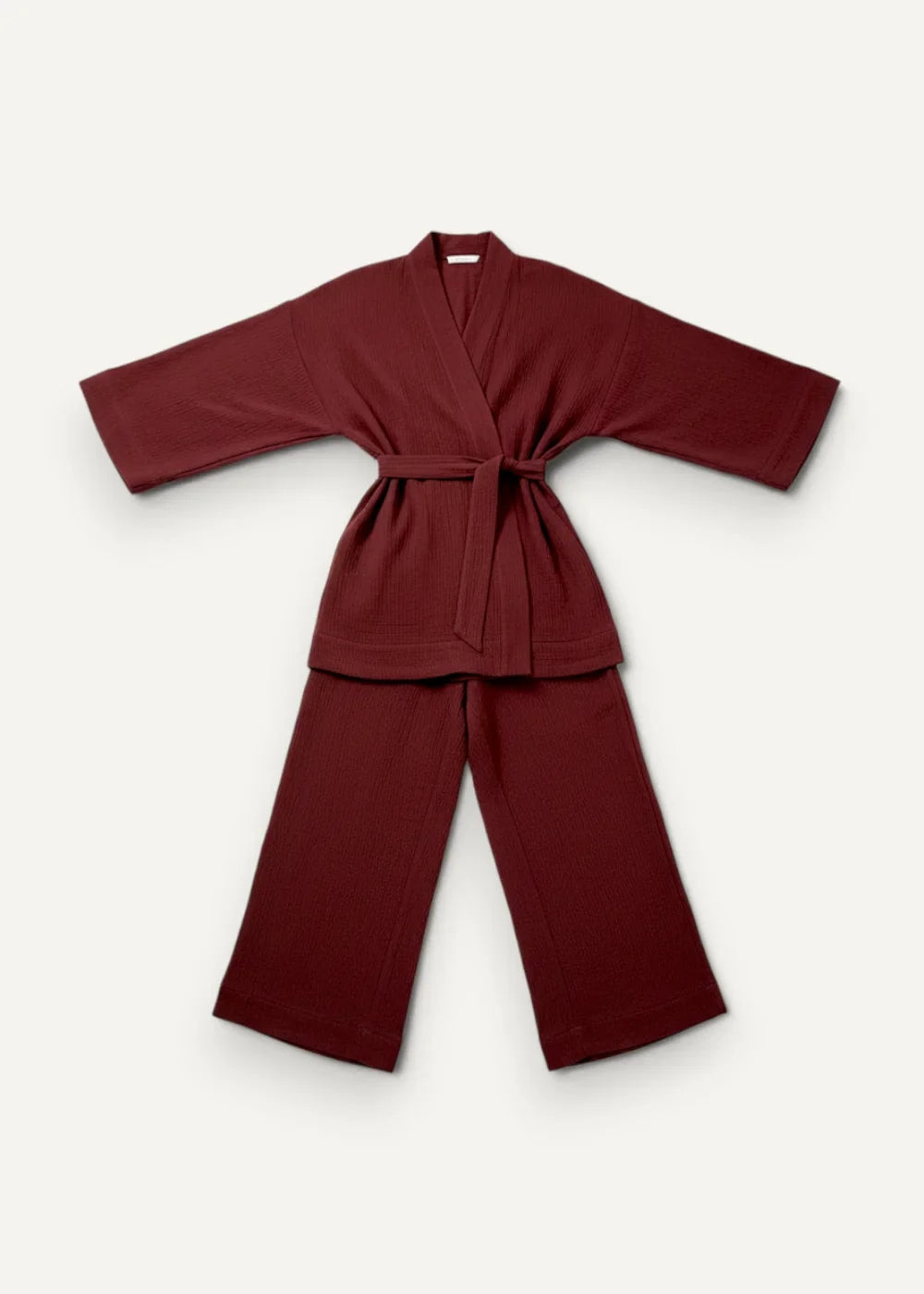 Maroon kimono pajama set with soft texture featuring a tied belt and matching wide-leg pants