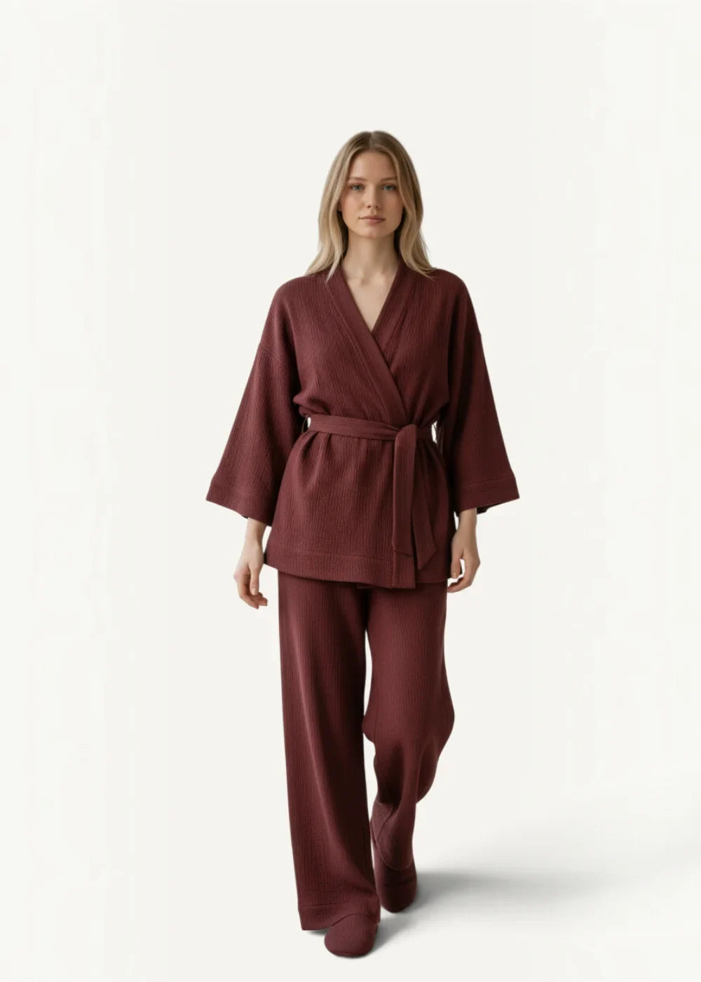 A maroon ribbed knit kimono pajama set with wide sleeves a matching belt and coordinating loose-fitting pants
