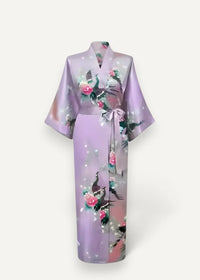 Lavender kimono silk bathrobe with peacock and rose pattern tied at the waist with a matching satin ribbon
