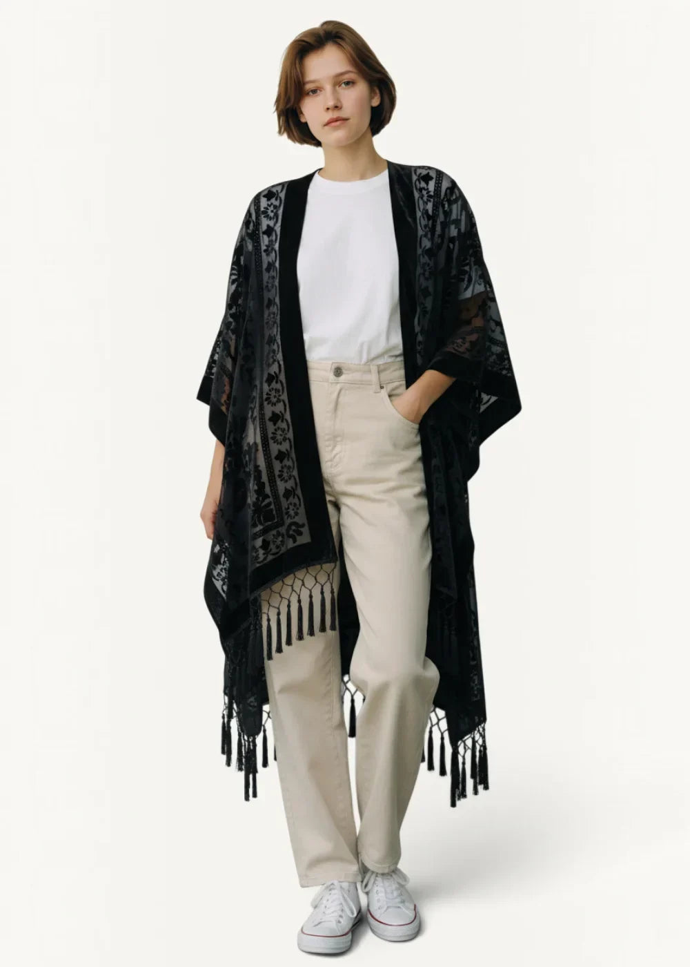 Black lace kimono style cardigan with intricate floral patterns and dangling tassels visible from the back side
