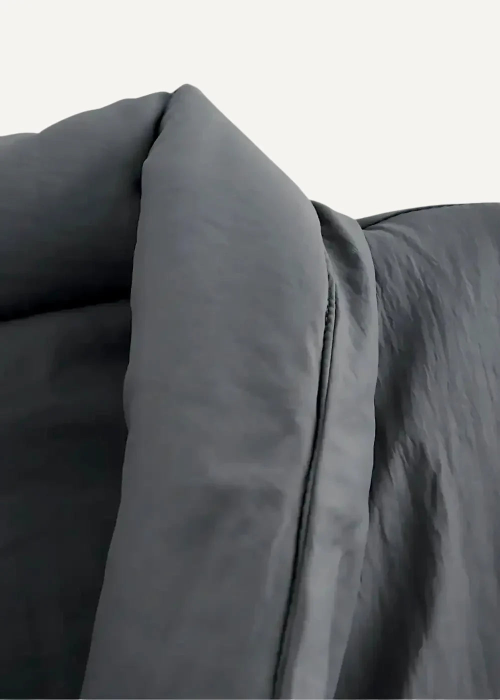 Dark gray kimono style coat made of plush quilted fabric with visible stitching along the seam