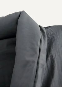 Dark gray kimono style coat made of plush quilted fabric with visible stitching along the seam