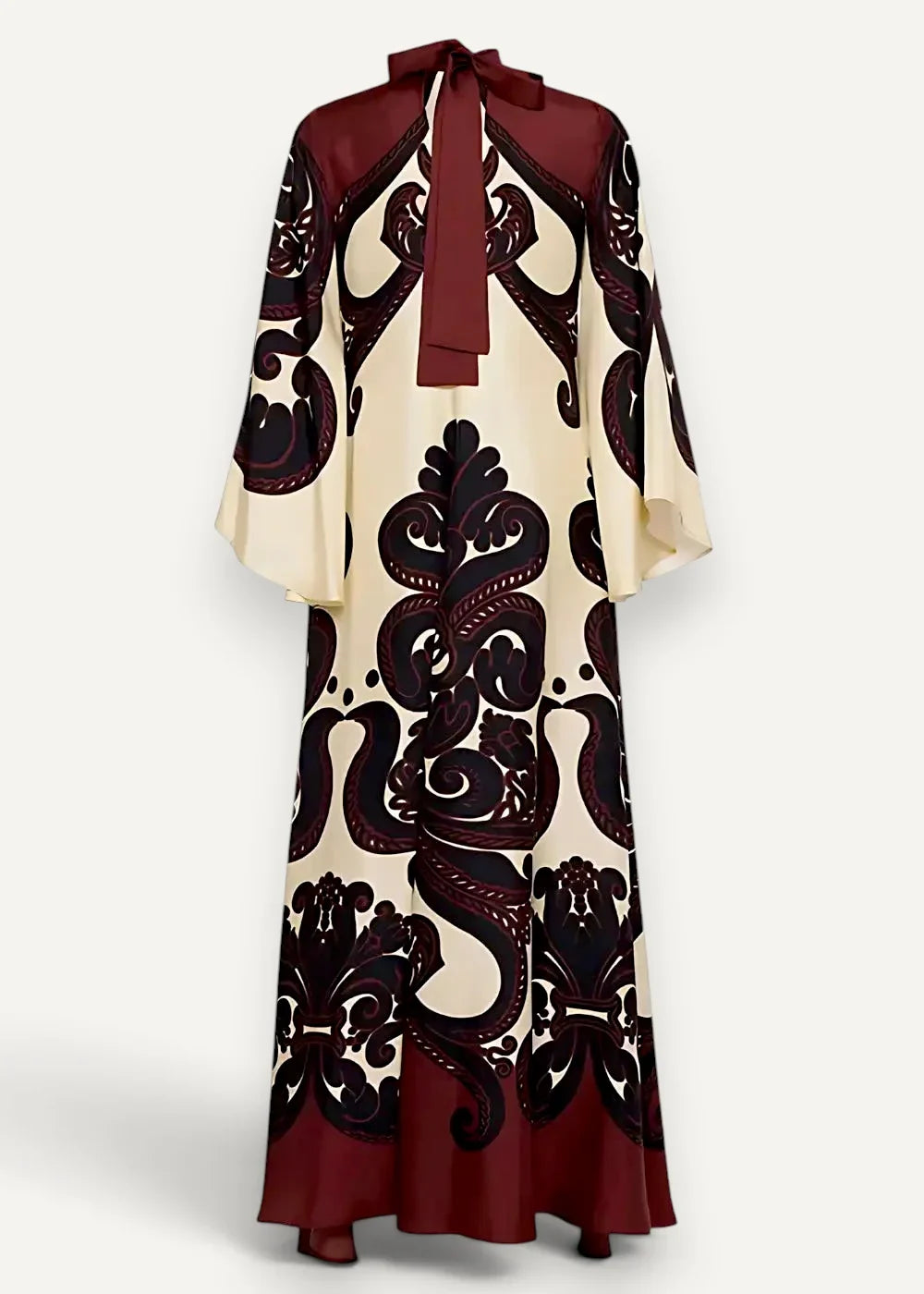 Kimono style dress long with cream and burgundy flowing fabric, intricate black paisley pattern, and bow neckline