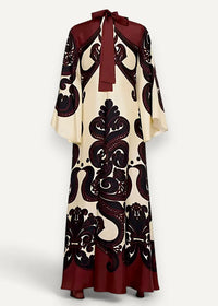 Kimono style dress long with cream and burgundy flowing fabric, intricate black paisley pattern, and bow neckline