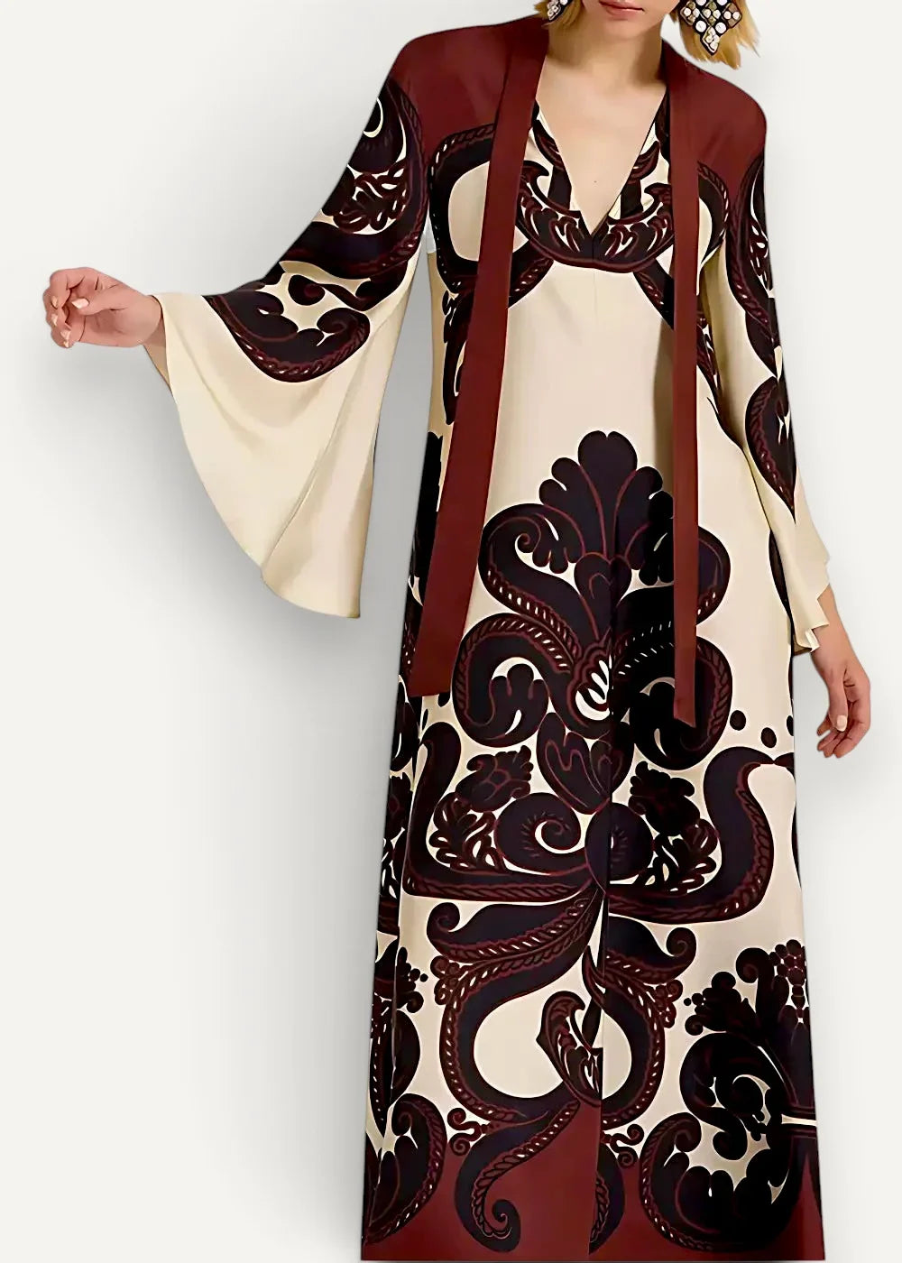 Kimono style dress long featuring a flowing cream and burgundy fabric with an intricate black floral pattern
