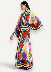 Kimono style dress flowing off-white maxi with bold red purple blue floral patterns and geometric borders