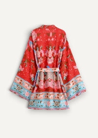 A vibrant red kimono style dress short with a floral pattern in pink blue and beige tones