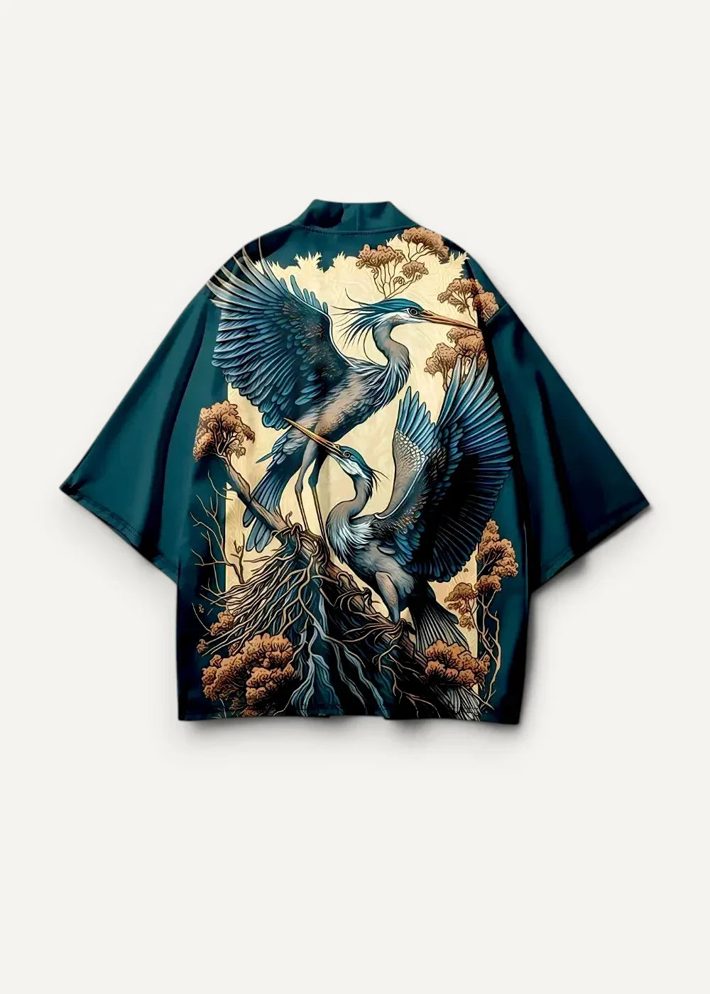 Dark teal kimono style jacket with detailed blue heron illustration on gnarled roots on cream background