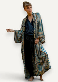 Kimono style maxi dress with a flowing geometric patterned robe in teal beige and black shown from the back