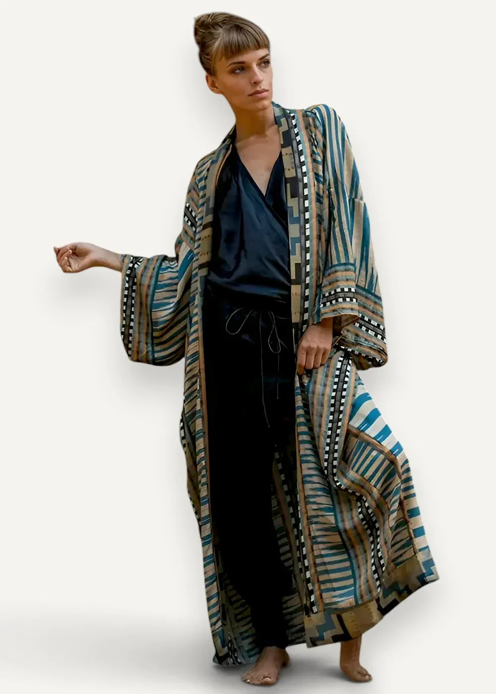 Kimono style maxi dress with a flowing geometric patterned robe in teal beige and black shown from the back