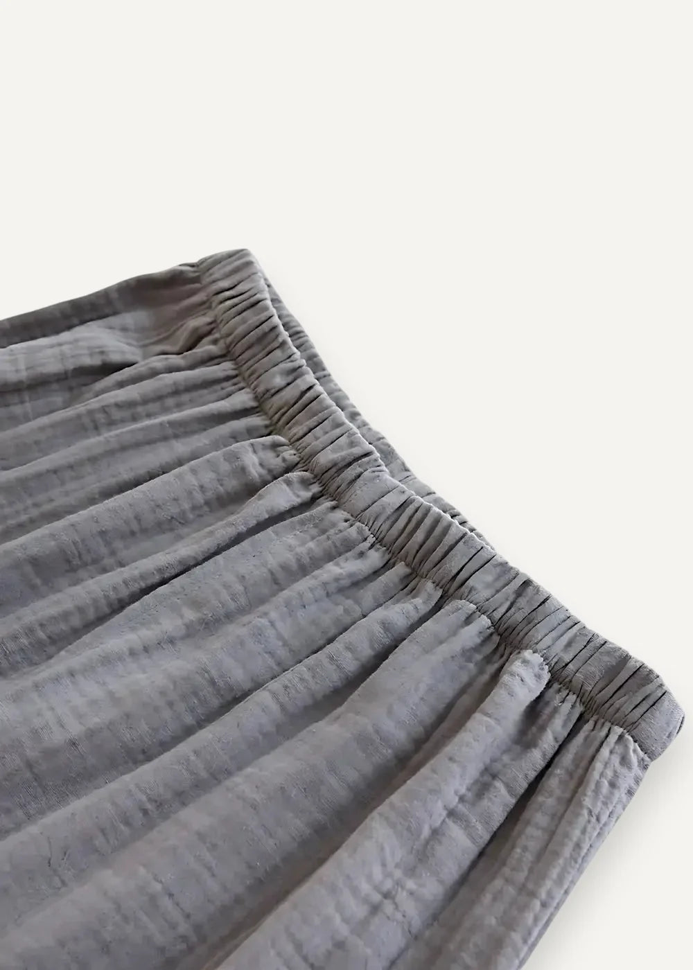 Gray kimono style pajama pants with a soft textured weave and gathered elastic waistband