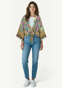 A vibrant floral-patterned kimono style top with wide sleeves and a tie-front closure in lightweight fabric