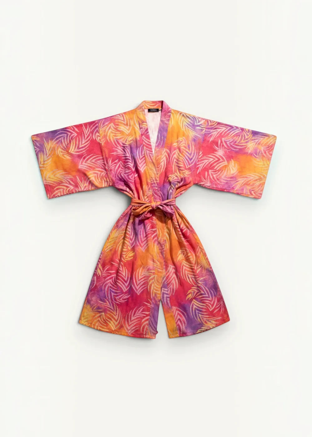 A vibrant kimono wrap dress maxi with short sleeves and tropical leaf pattern in pink orange and purple shades