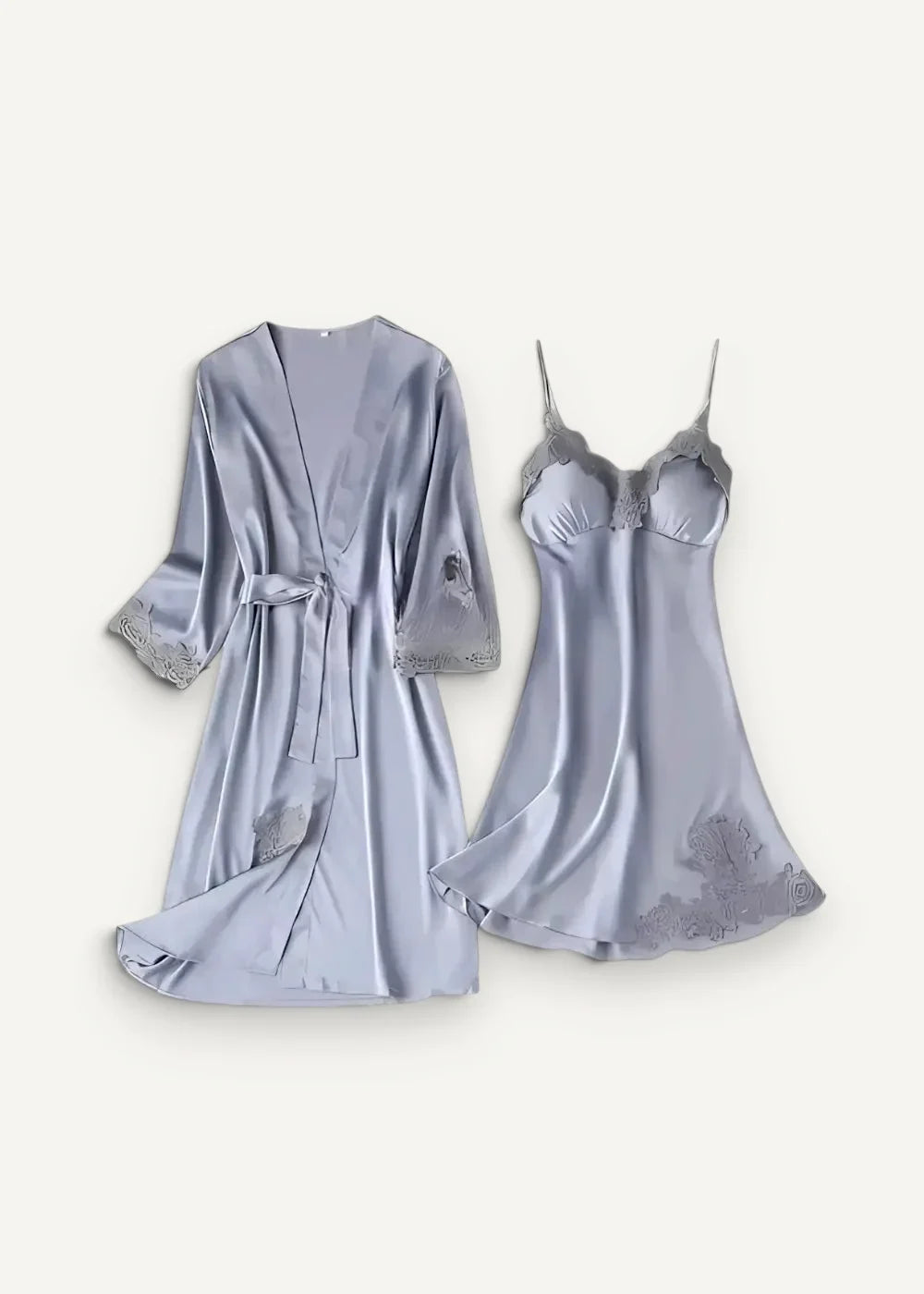 A soft lavender satin lace nightgown and robe set with delicate lace trim and floral embroidery details