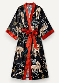 Black satin leopard robe with vibrant red ribbon belt and trim featuring beige and gold leopard pattern on dark background