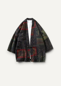 Dark gray linen haori kimono with intricate red and brown geometric patchwork patterns visible on the back side