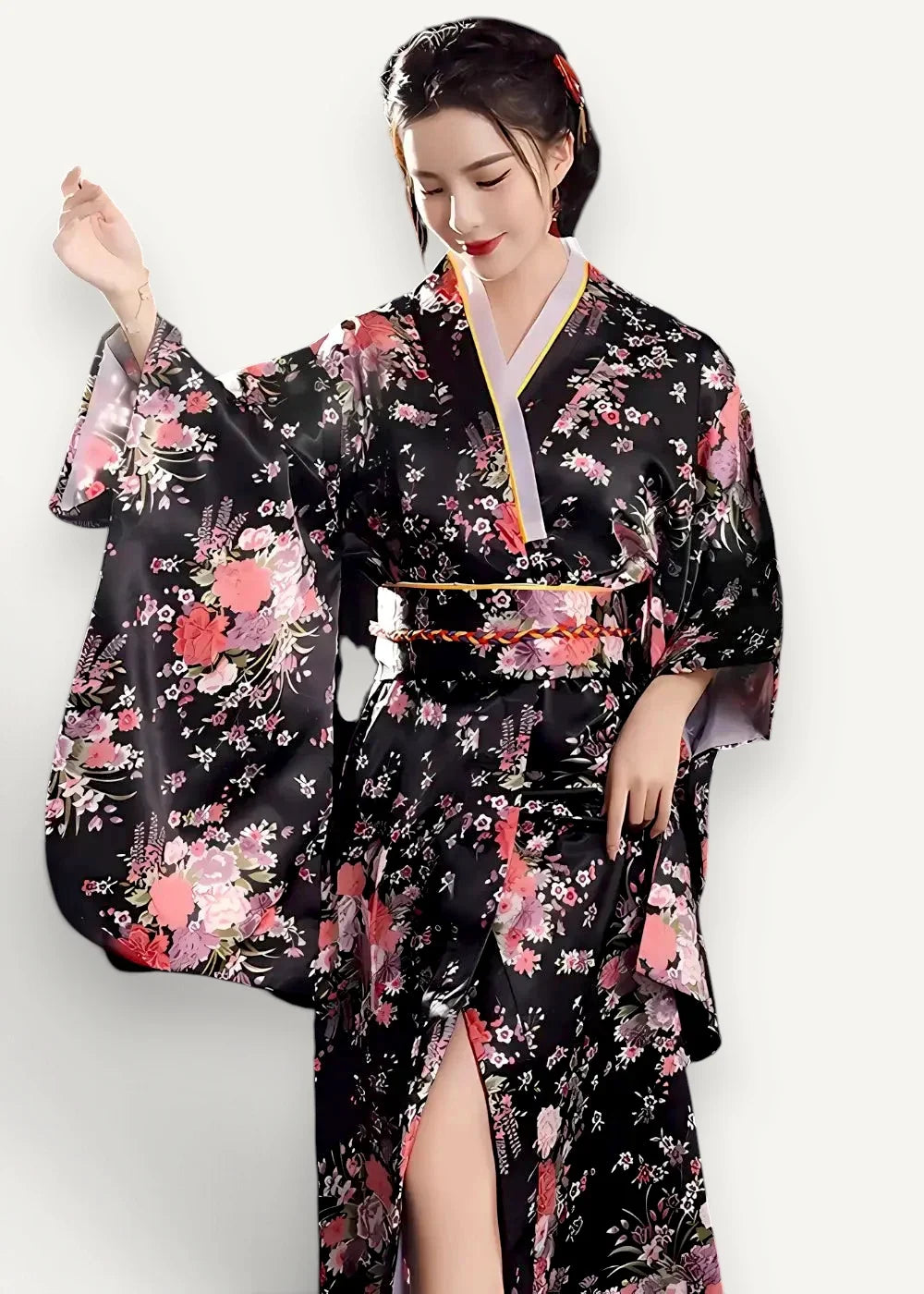 Long black kimono made of elegant silk with vibrant pink and white floral patterns and a gold-trimmed obi belt
