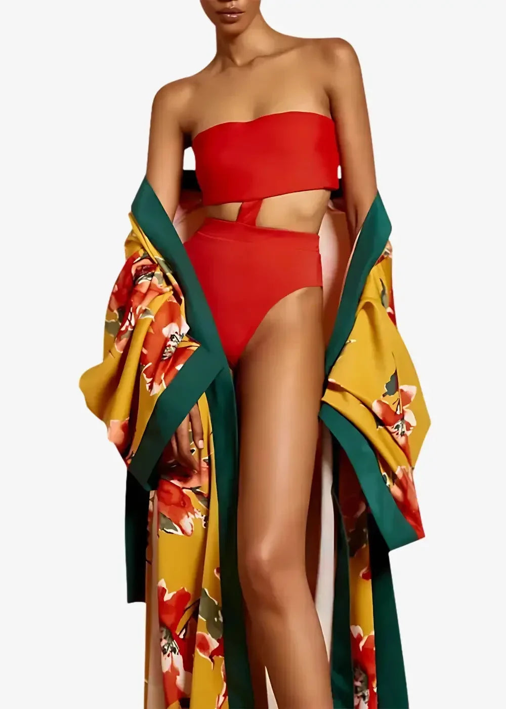 Long floral kimono duster with bold yellow and green floral patterns paired with a vibrant red strapless high-cut bikini set