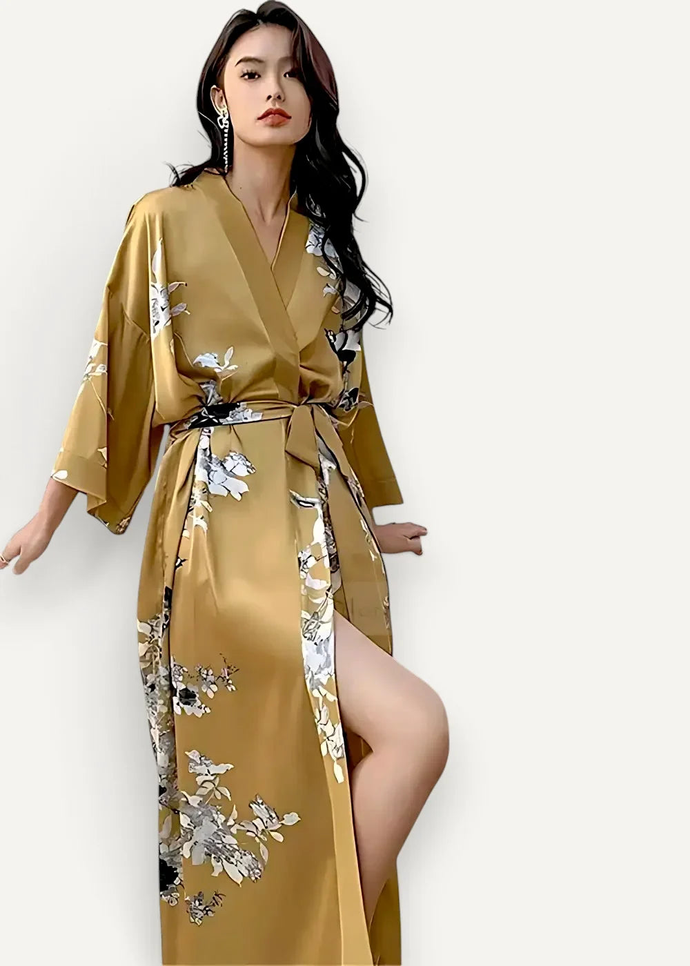 Long gold satin robe with flowing silk fabric and delicate white and gray floral patterns tied at the waist