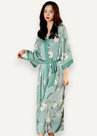 Long green satin robe featuring a flowing mint green fabric with a delicate white floral pattern and matching belt