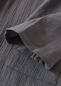 Long kimono style dressing gown sleeve in gray textured cotton with subtle ribbed pattern and stitched pocket detail