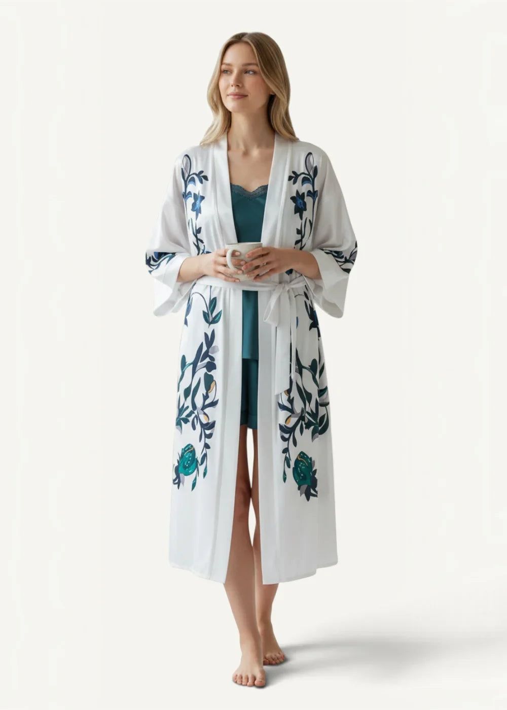 Long satin kimono dressing gown in white with blue floral embroidery and matching teal undergarment displayed front side