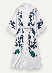 Long satin kimono dressing gown in white with embroidered blue and green floral patterns on a kimono-style robe