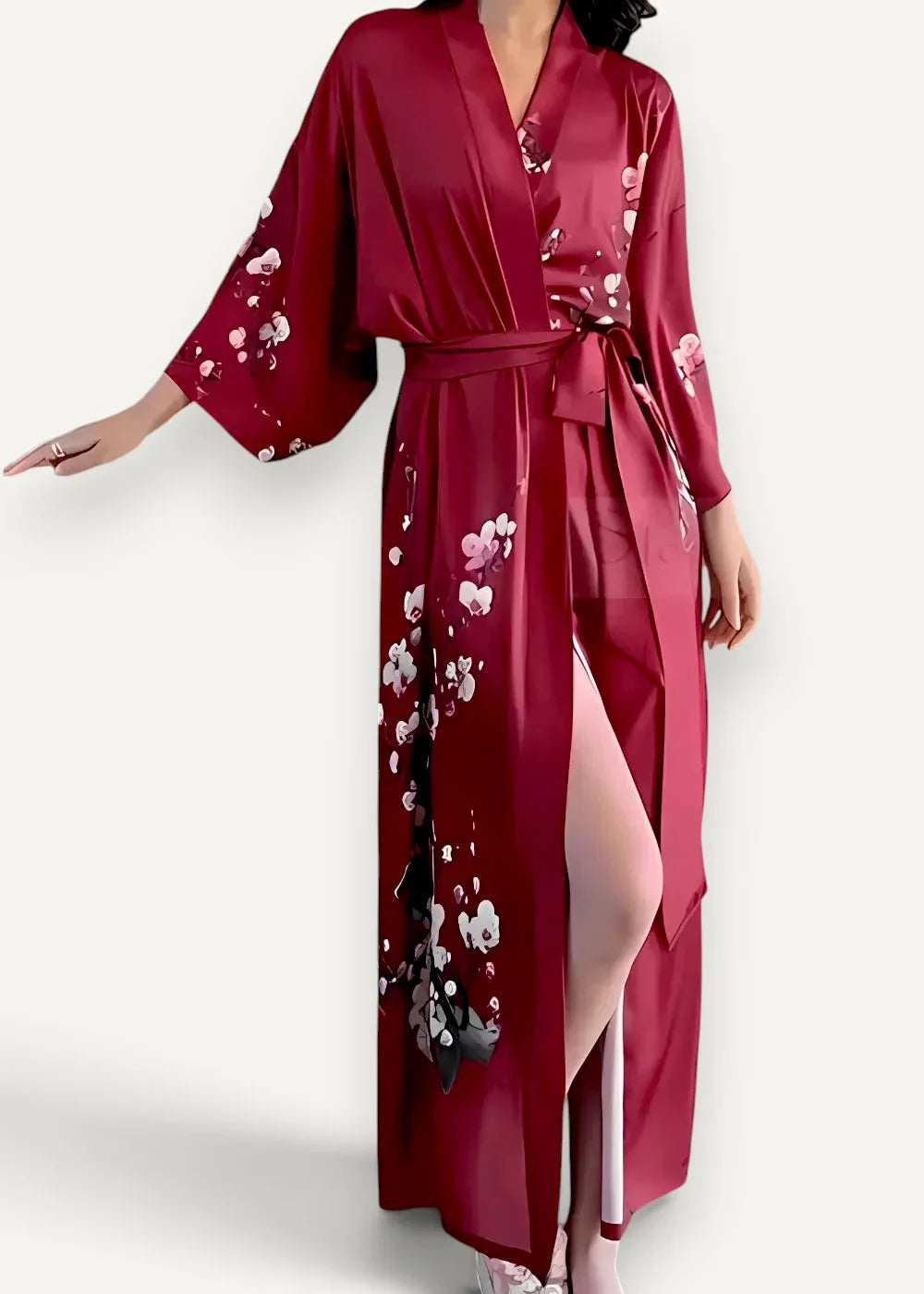 Long satin robe in deep red with flowing satin fabric and delicate white and black floral patterns on sleeves and sides