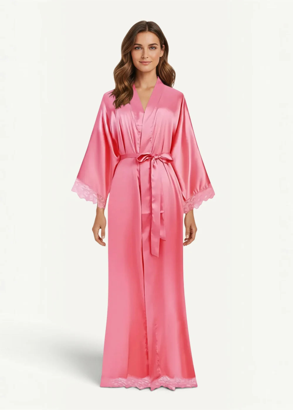 Long silk kimono robe in flowing pink satin with delicate lace trim at cuffs and hem tied with matching belt