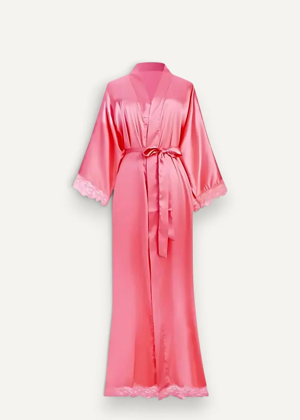 A flowing pink long silk kimono robe with delicate lace trim on cuffs and hem tied at the waist with a belt