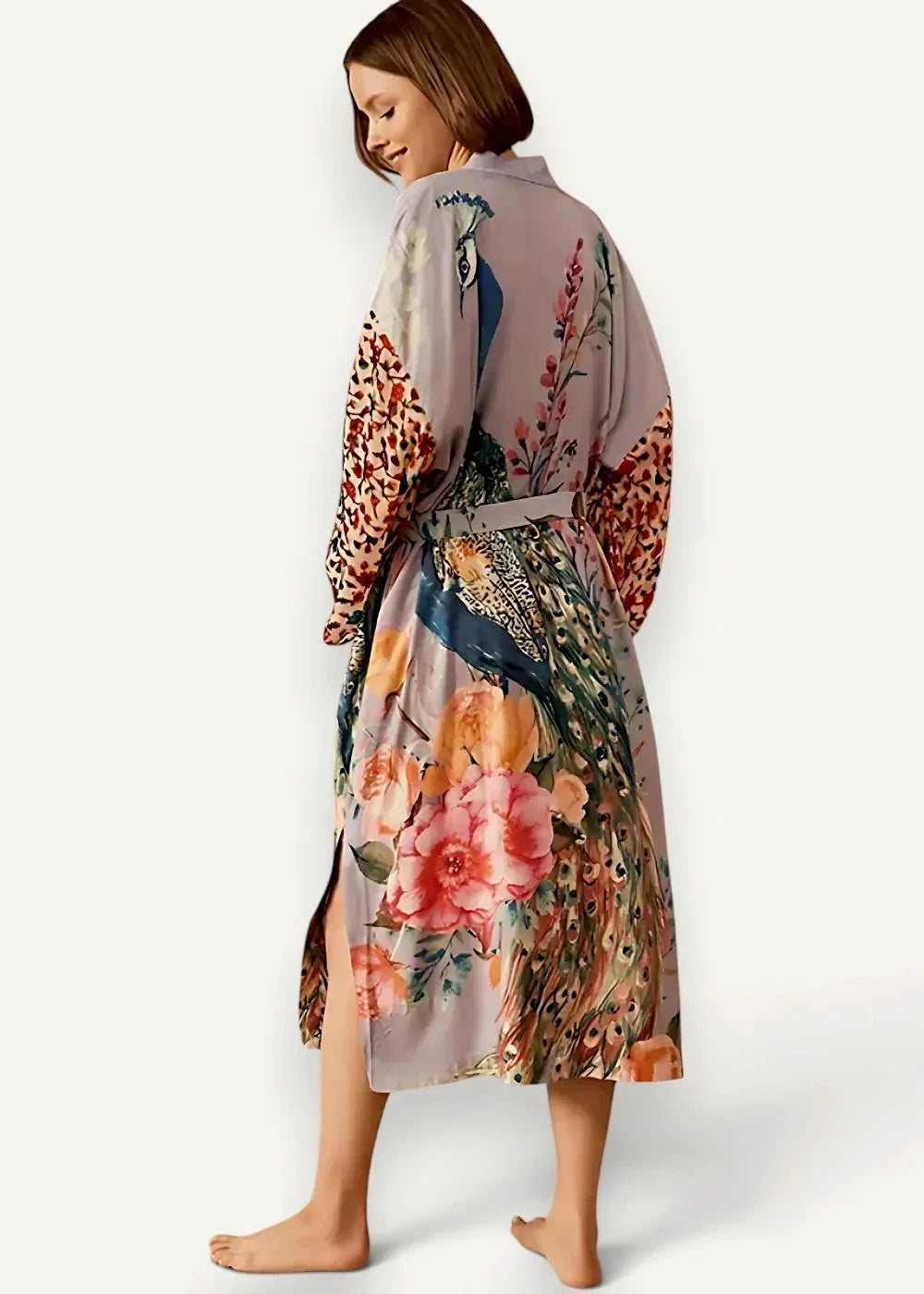 Long white kimono cover up made of flowing lavender silk with vibrant peacock floral pattern and matching belt