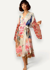 Long white kimono cover up with flowing long sleeves and vibrant pink blue red floral and bird print