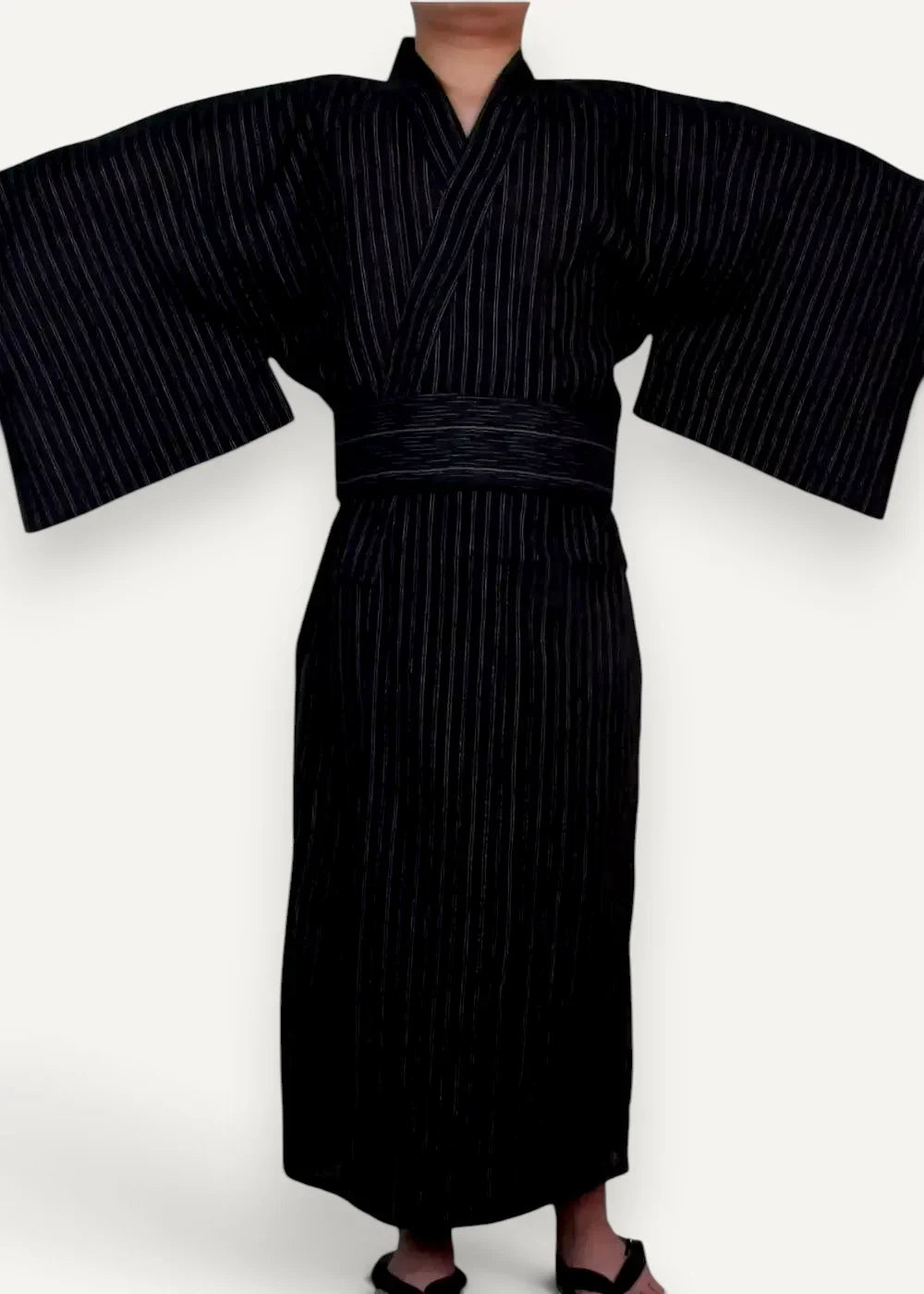 Men’s kimono traditional black robe with fine vertical stripes and matching belt shown from the back side