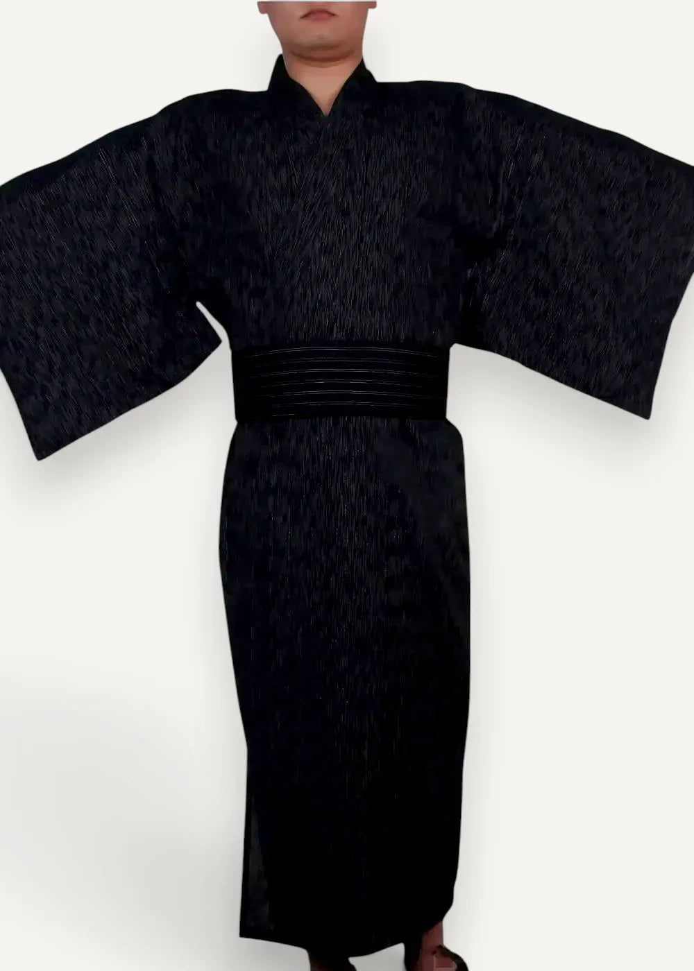 Men’s kimono traditional in black textured fabric with wide sleeves and matching obi belt for formal wear