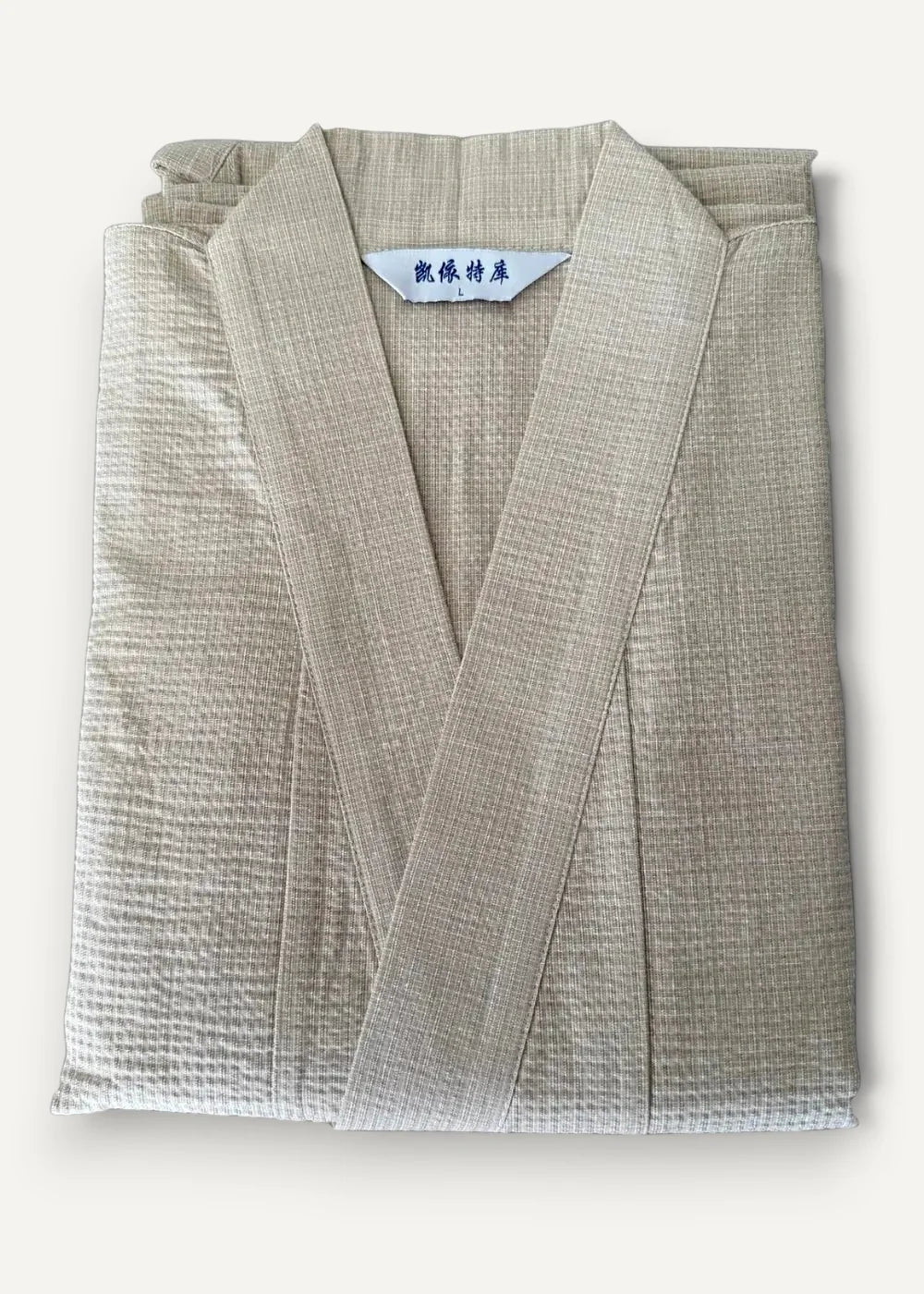 Men’s kimono traditional beige woven fabric robe with v-neck design and subtle texture neatly folded