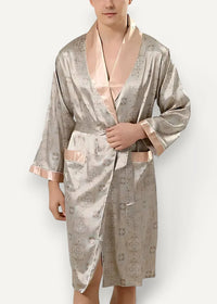 Men’s satin kimono robe in shimmering silver with subtle geometric pattern and contrasting peach lining cuffs and belt