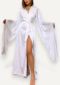 White satin modern kimono dress with wide flowing sleeves and a high slit showcasing elegant design
