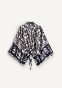 Navy blue kimono cover up with flowing black and white floral print wide sleeves tied at the front