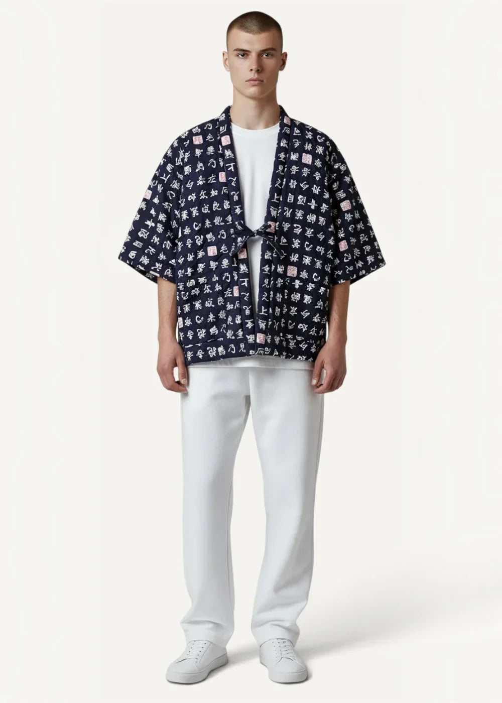 Navy blue kimono jacket with short sleeves and white and pink Japanese character print on lightweight fabric