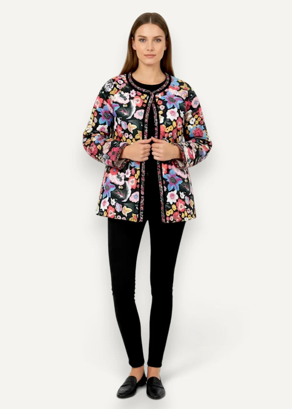A vibrant padded kimono coat with a black base, floral quilted pattern, and embroidered collar and front placket
