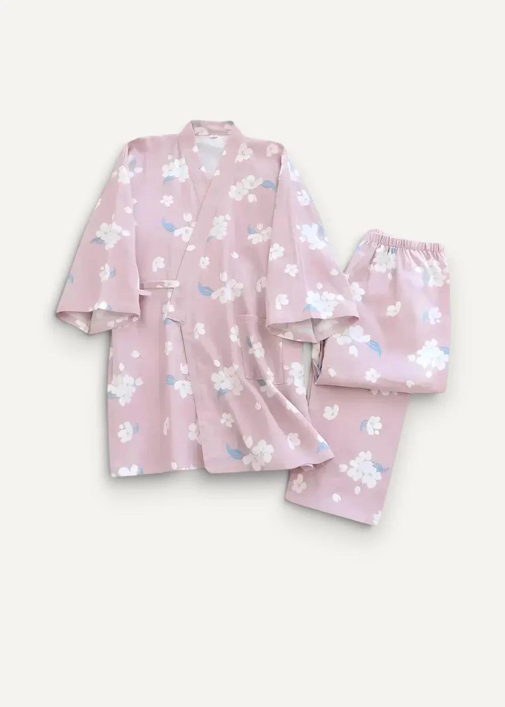Pink floral kimono pajamas featuring white and light blue blossoms on soft satin fabric for comfortable lounging